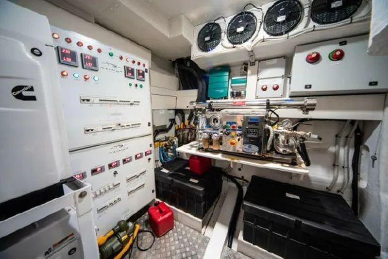 Fantastic Yacht Photos Pics Engine room of a 2019 Azimut 77S yacht with control panels and machinery.