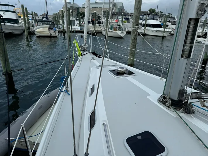 J Renee Yacht Photos Pics 2004 Catalina 42 MkII sailboat docked in marina, surrounded by other boats.