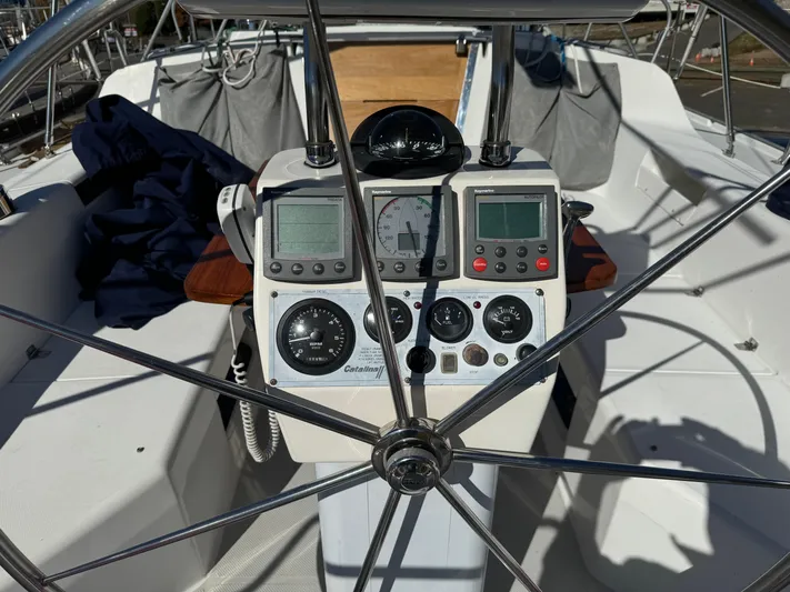 J Renee Yacht Photos Pics Cockpit of 2004 Catalina 42 MkII sailboat with navigation instruments and steering wheel.