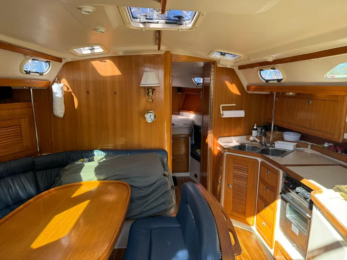 J Renee Yacht Photos Pics Interior of 2004 Catalina 42 MkII sailboat with wood finish and cozy seating area.
