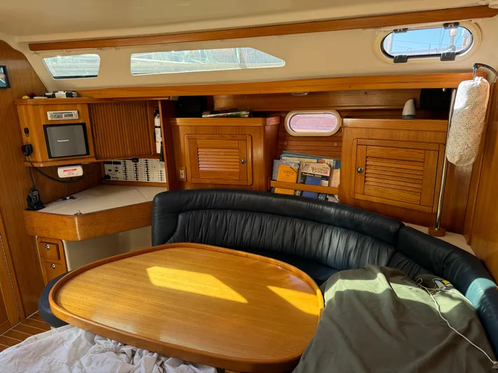 J Renee Yacht Photos Pics Interior of 2004 Catalina 42 MkII sailboat with wooden cabinetry and seating area.