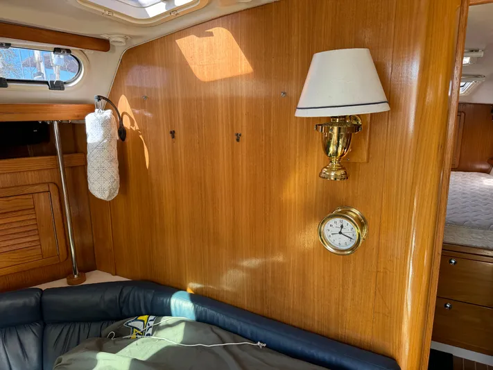 J Renee Yacht Photos Pics Interior of 2004 Catalina 42 MkII sailboat with wood paneling and brass fixtures.