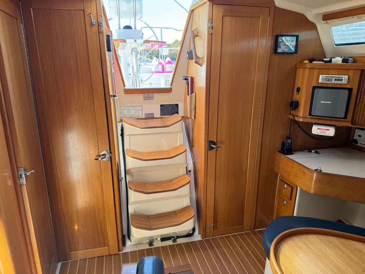 J Renee Yacht Photos Pics Interior of 2004 Catalina 42 MkII sailboat with wooden cabinetry and steps.