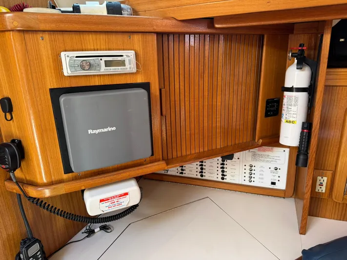 J Renee Yacht Photos Pics 2004 Catalina 42 MkII navigation station with Raymarine equipment and fire extinguisher.
