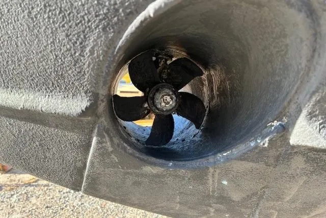 Jambo Yacht Photos Pics Propeller of 2011 Pursuit OS 345 Offshore boat, close-up view.