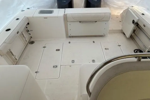 Jambo Yacht Photos Pics 2011 Pursuit OS 345 Offshore boat interior with spacious deck and storage compartments.