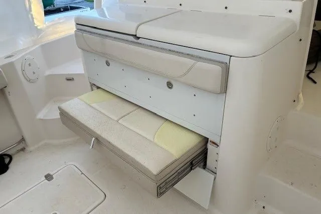 Jambo Yacht Photos Pics 2011 Pursuit OS 345 Offshore boat interior with fold-out seating and storage.