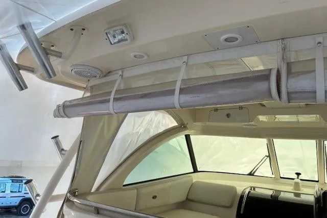 Jambo Yacht Photos Pics 2011 Pursuit OS 345 Offshore boat interior with seating and rod holders.