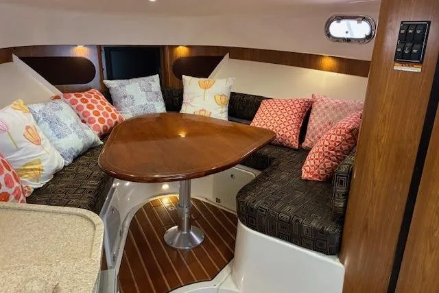 Jambo Yacht Photos Pics 2011 Pursuit OS 345 Offshore cabin with cozy seating and colorful cushions.