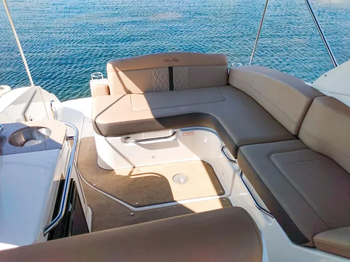 280 Sundancer Yacht Photos Pics 2016 Sea Ray 280 Sundancer boat interior with beige seating, overlooking calm blue water.