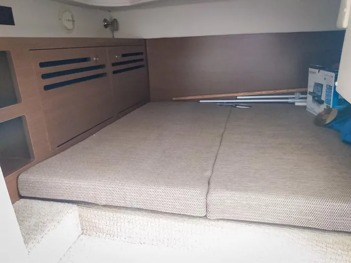 280 Sundancer Yacht Photos Pics Cabin interior of 2016 Sea Ray 280 Sundancer with cushioned seating and storage.