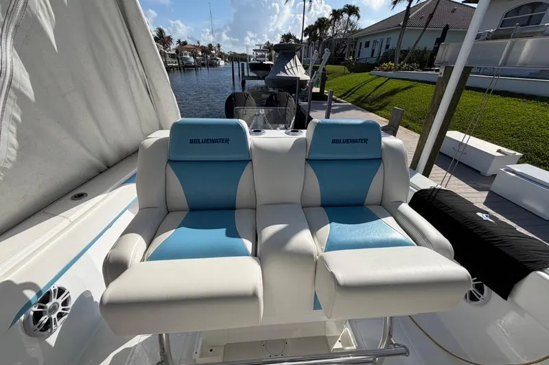  Yacht Photos Pics 2022 Bluewater 2850 CC boat with dual blue and white cushioned seats.