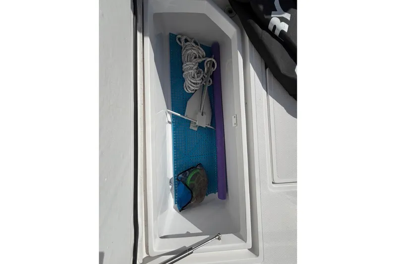  Yacht Photos Pics Storage compartment on a 2022 Bluewater 2850 CC boat with rope and anchor.