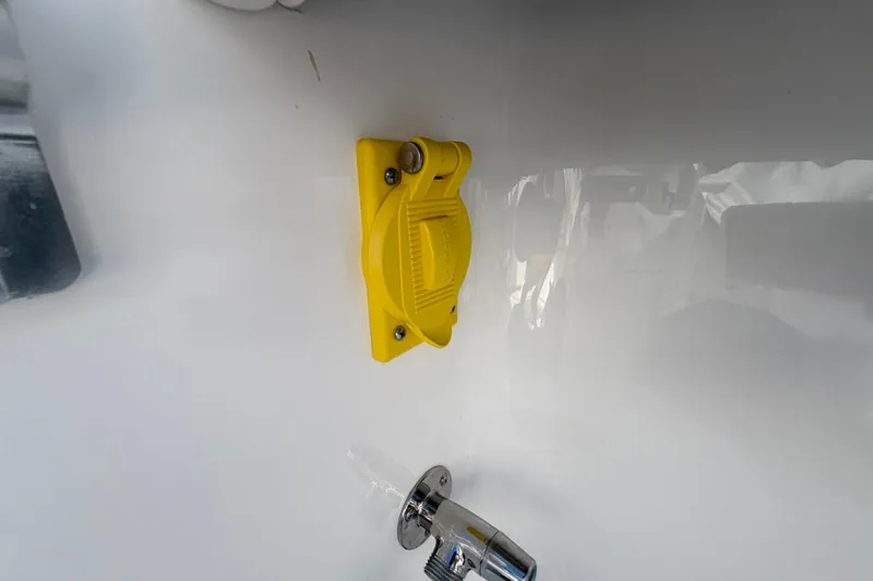  Yacht Photos Pics Yellow latch and metal fixture on 2022 Bluewater 2850 CC boat interior.
