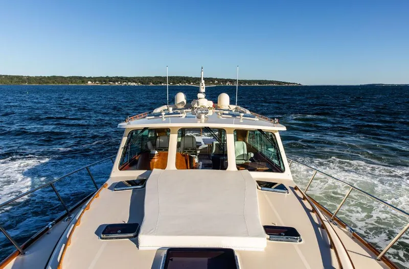 Cassidy Yacht Photos Pics Hinckley Talaria 48 MY 2013 cruising on open water under clear blue skies.