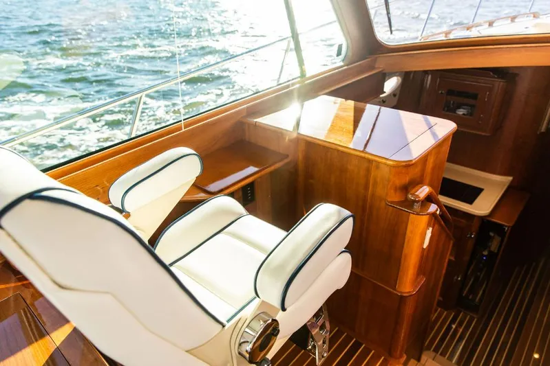 Cassidy Yacht Photos Pics Luxurious interior of 2013 Hinckley Talaria 48 MY yacht with elegant seating and wood finish.