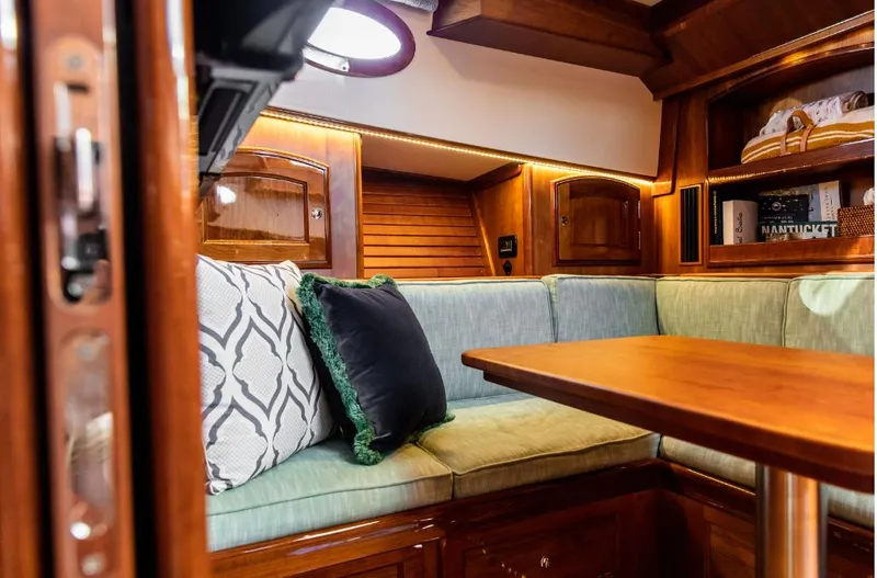 Cassidy Yacht Photos Pics Interior of 2013 Hinckley Talaria 48 MY yacht with elegant wood finish and cozy seating.