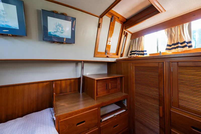 Sojourn Yacht Photos Pics Interior of 1990 Grand Banks 36 Classic yacht with wooden cabinetry and nautical decor.