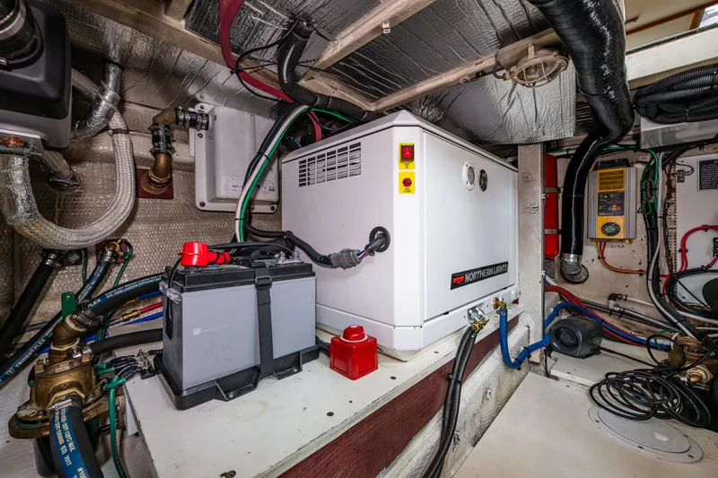 Sojourn Yacht Photos Pics Engine room of 1990 Grand Banks 36 Classic with generator and battery setup.