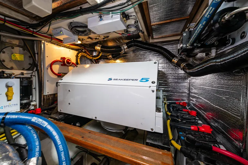 Sojourn Yacht Photos Pics Engine room of 1990 Grand Banks 36 Classic with Seakeeper 5 stabilizer system.