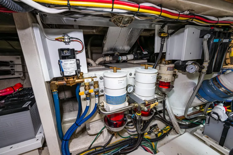 Sojourn Yacht Photos Pics Engine room of a 1990 Grand Banks 36 Classic, showcasing fuel filters and wiring.