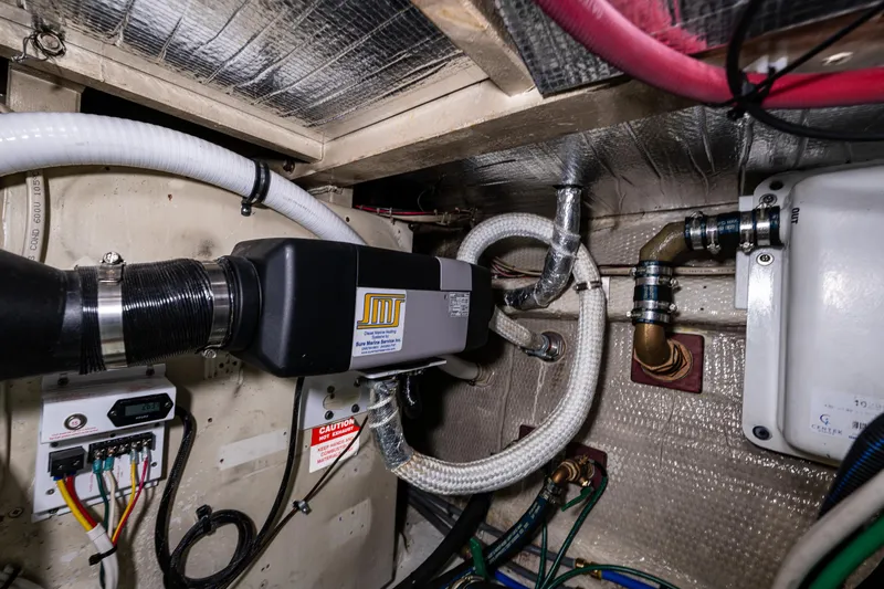 Sojourn Yacht Photos Pics Engine room of 1990 Grand Banks 36 Classic yacht with mechanical components and wiring.