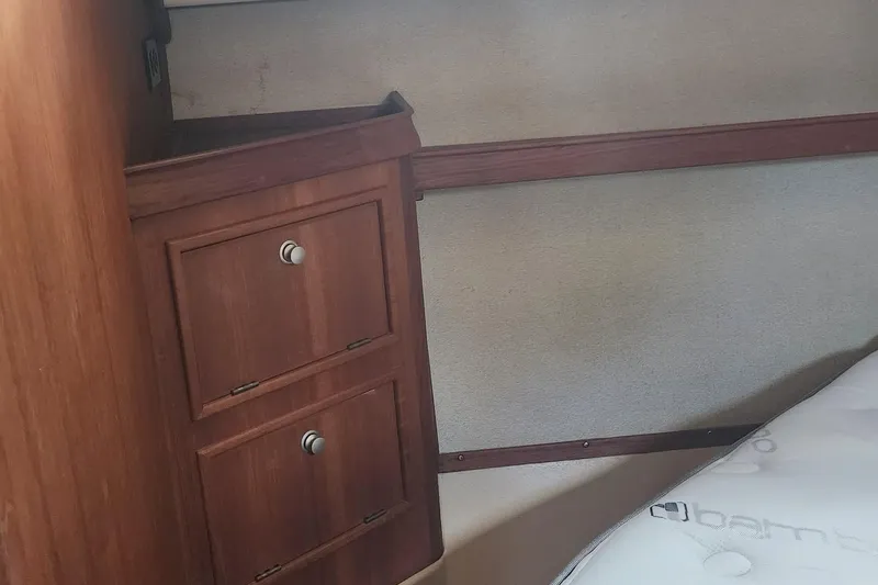 Ramble On Yacht Photos Pics Wooden cabinetry and bed in 2000 Island Packet 380 yacht interior.