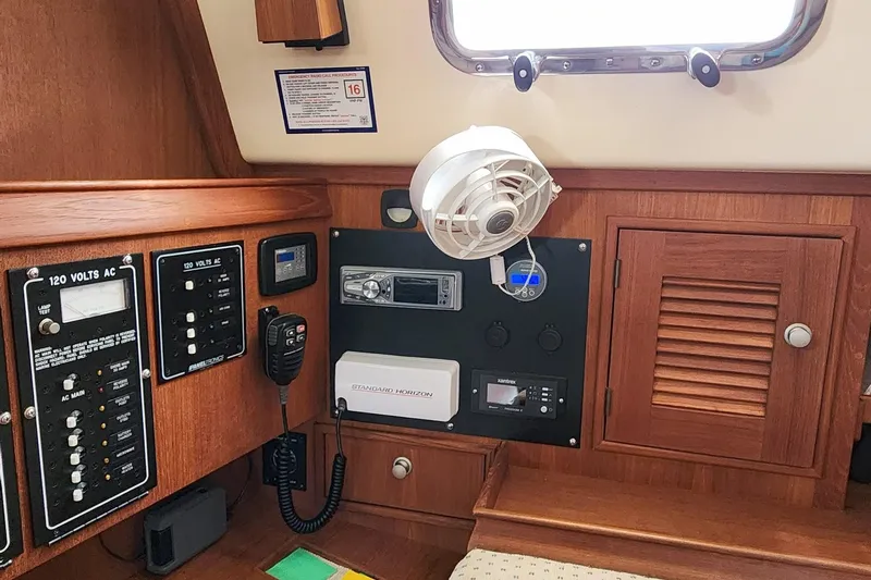 Ramble On Yacht Photos Pics Interior of 2000 Island Packet 380 sailboat with control panels and fan.
