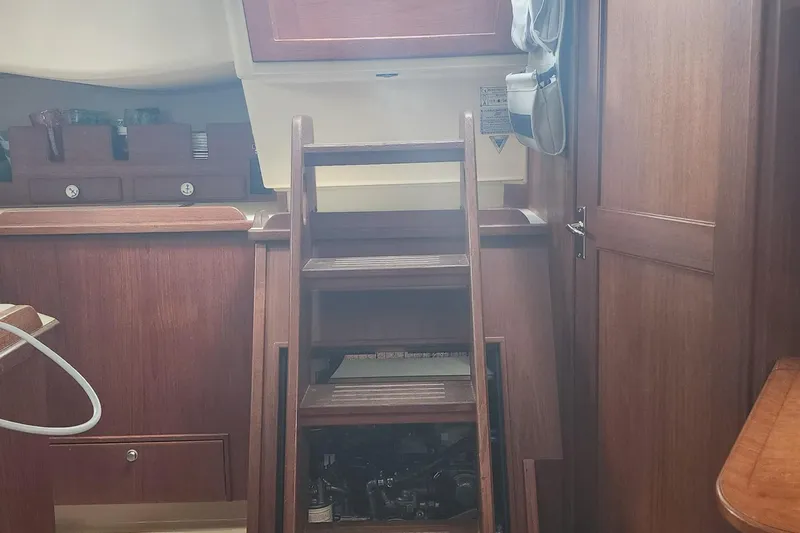 Ramble On Yacht Photos Pics Interior of 2000 Island Packet 380 sailboat with wooden steps and cabinetry.