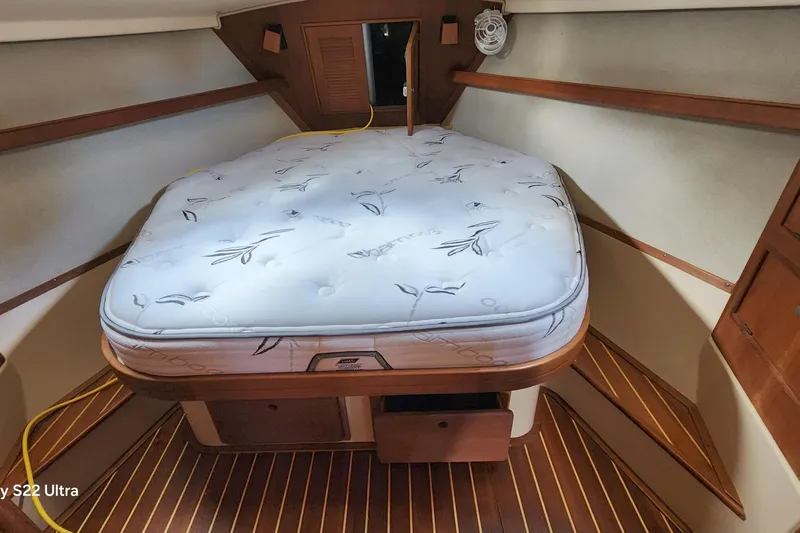 Ramble On Yacht Photos Pics Cozy cabin interior of 2000 Island Packet 380 sailboat with comfortable mattress.