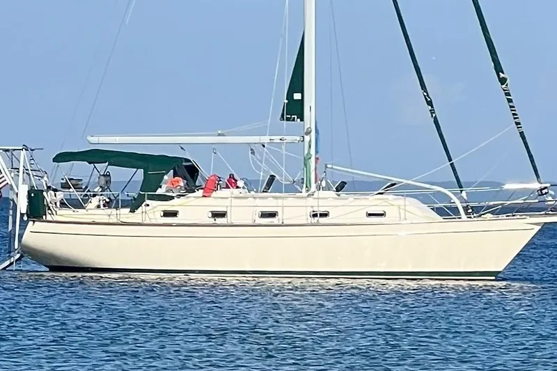 Ramble On Yacht Photos Pics Island Packet 380 sailboat from 2000 on calm blue waters.
