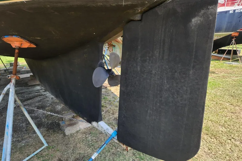 Ramble On Yacht Photos Pics Bottom view of 2000 Island Packet 380 sailboat with propeller and rudder visible.