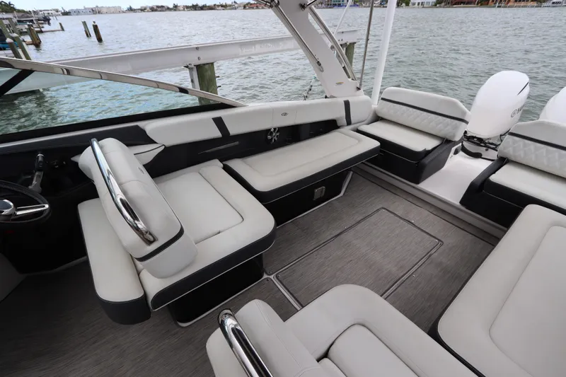  Yacht Photos Pics 2018 Regal 29 OBX boat interior with luxurious seating and waterfront view.