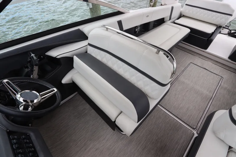  Yacht Photos Pics 2018 Regal 29 OBX boat interior with luxurious seating and steering wheel.