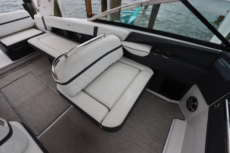  Yacht Photos Pics 2018 Regal 29 OBX boat interior with white leather seating and cup holders.