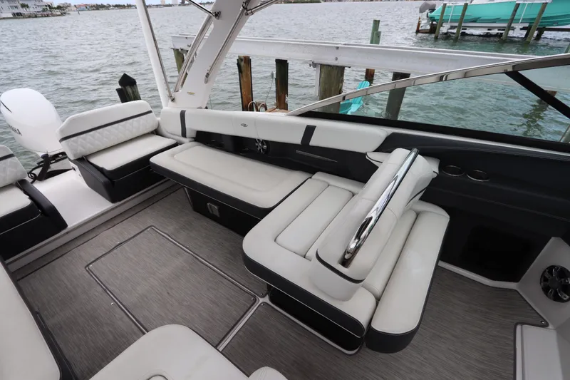  Yacht Photos Pics 2018 Regal 29 OBX boat interior with luxurious seating and waterfront view.