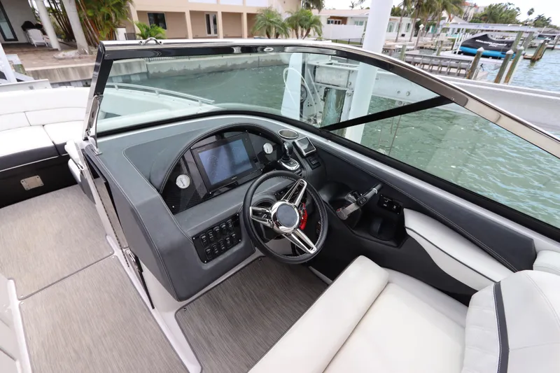  Yacht Photos Pics 2018 Regal 29 OBX boat cockpit with modern steering and control panel.
