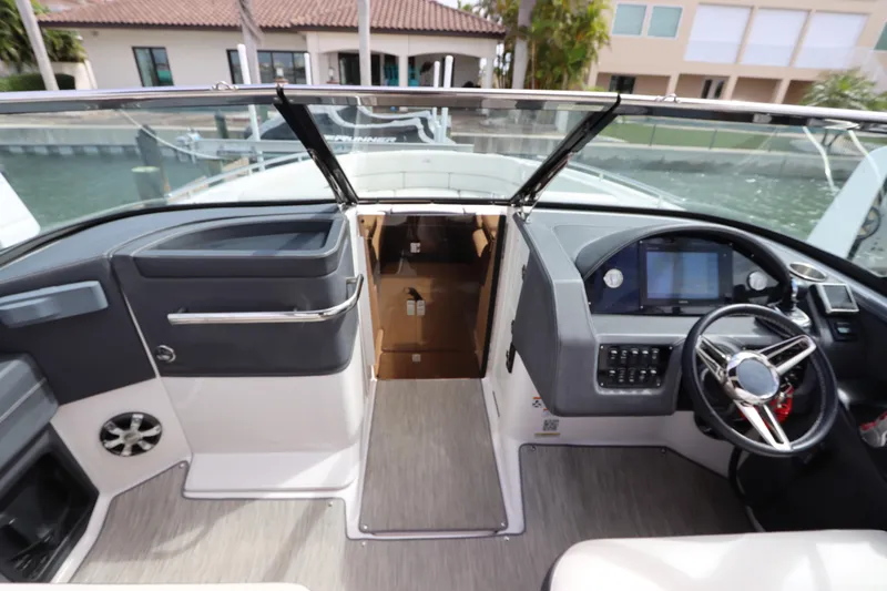  Yacht Photos Pics 2018 Regal 29 OBX boat interior with modern dashboard and steering wheel.