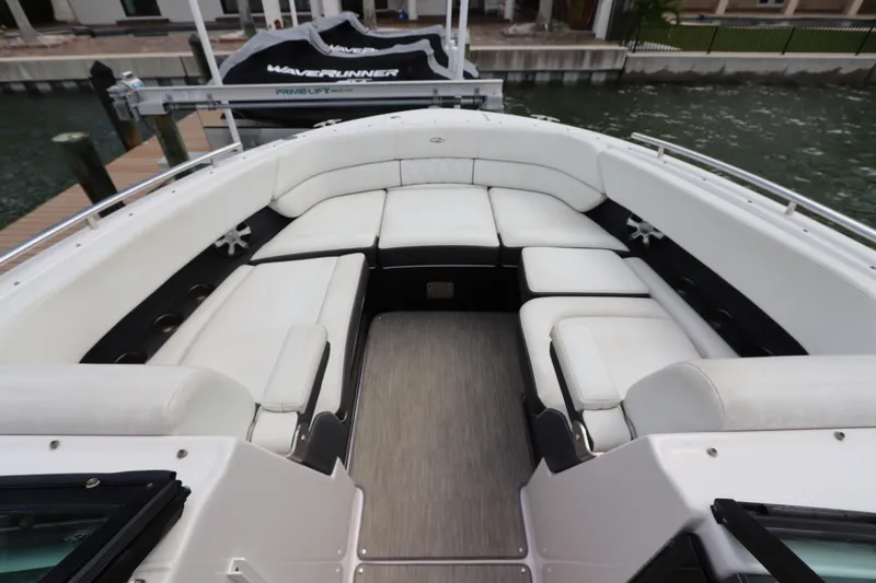  Yacht Photos Pics 2018 Regal 29 OBX boat interior with spacious white seating and sleek design.
