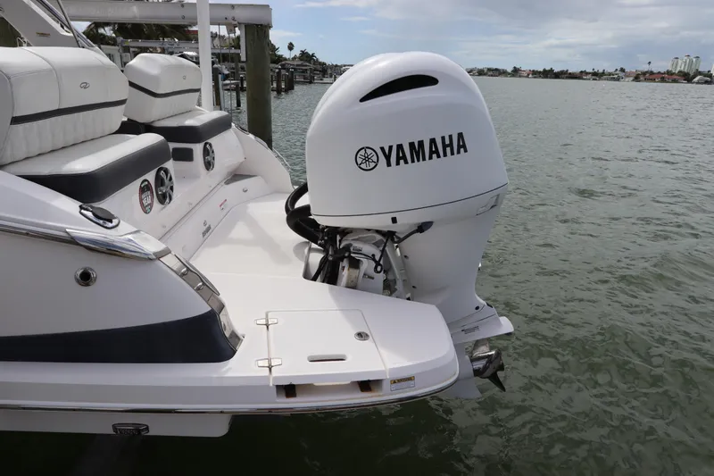  Yacht Photos Pics 2018 Regal 29 OBX boat with Yamaha outboard motor on water.