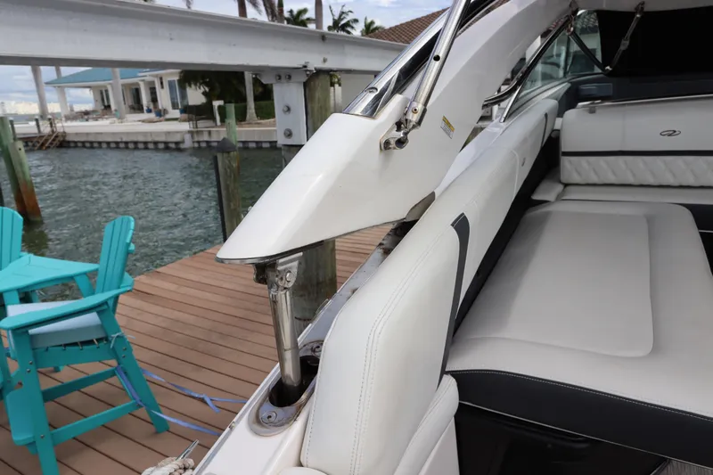  Yacht Photos Pics 2018 Regal 29 OBX boat interior with white seating and hydraulic mechanism.