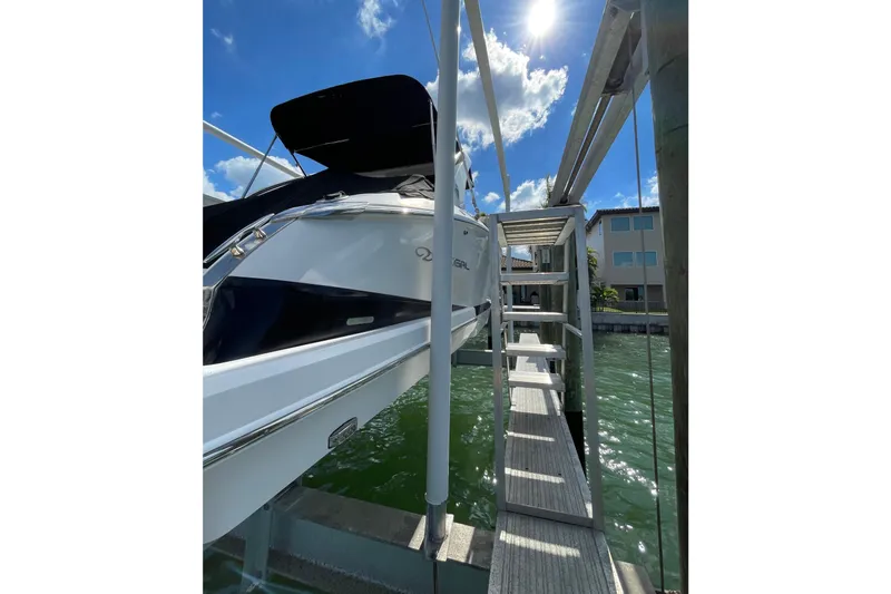  Yacht Photos Pics 2018 Regal 29 OBX boat docked under sunny skies.