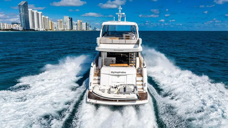 My Inspiration Yacht Photos Pics 2019 Sunseeker Manhattan 66 yacht cruising near city skyline on a sunny day.