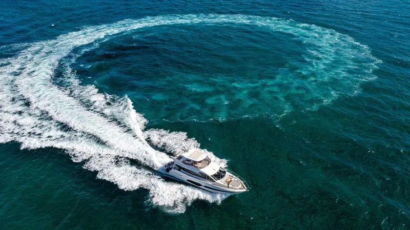 My Inspiration Yacht Photos Pics 2019 Sunseeker Manhattan 66 yacht creating a circular wake in the ocean.