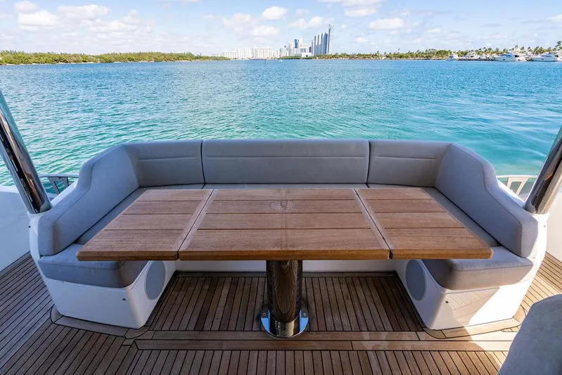 My Inspiration Yacht Photos Pics Sunseeker Manhattan 66 yacht deck with seating and table, overlooking ocean view, 2019 model.