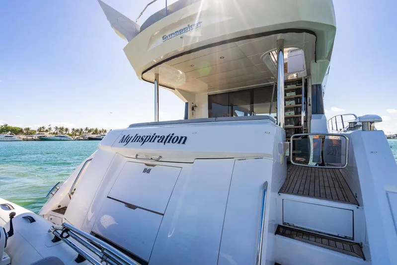 My Inspiration Yacht Photos Pics 2019 Sunseeker Manhattan 66 yacht on water, rear view with stairs and deck.