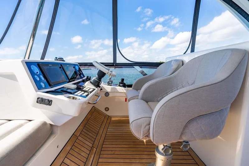 My Inspiration Yacht Photos Pics Luxurious 2019 Sunseeker Manhattan 66 yacht cockpit with modern controls and plush seating.