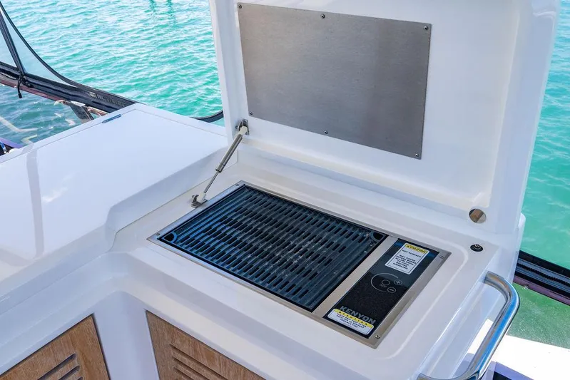 My Inspiration Yacht Photos Pics Outdoor grill on 2019 Sunseeker Manhattan 66 yacht, overlooking water.