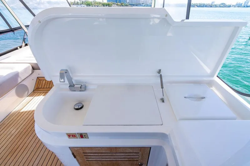 My Inspiration Yacht Photos Pics Outdoor kitchenette on 2019 Sunseeker Manhattan 66 yacht with sink and storage.