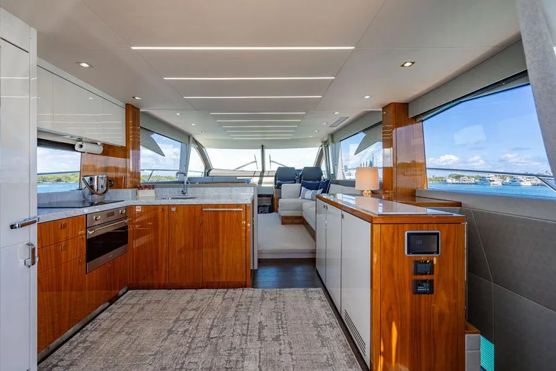 My Inspiration Yacht Photos Pics Luxurious interior of 2019 Sunseeker Manhattan 66 yacht with modern kitchen and seating area.